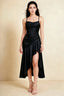 Front view of the LVLVS Ada black midi dress, showing the draped neckline, thin straps and high-low ruffled skirt.