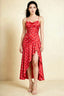Front view of the LVLVS Ada red polka dot midi dress, showing the draped neckline, thin straps and high-low ruffled skirt.