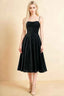 Front view of the LVLVS Aileen black midi dress, showing the thin shoulder straps, gathered bodice and flared midi skirt.