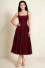 Front view of the LVLVS Alana wine midi dress, showing the pearl-trimmed square neckline, shaped bodice and gathered full skirt.