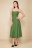 Front view of the LVLVS Alina basil midi dress, showing the draped neckline, thin shoulder straps and flowing flared skirt.