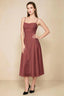 Front view of the LVLVS Alina burnt umber midi dress, showing the draped neckline, thin shoulder straps and flowing flared skirt.