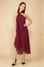 Front view of the LVLVS Alma burgundy midi dress, showing the asymmetric neckline, draped neck scarf and flowing uneven hem.