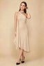 Front view of the LVLVS Alma champagne midi dress, showing the asymmetric neckline, draped neck scarf and flowing uneven hem.