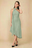 Front view of the LVLVS Alma sage green midi dress, showing the asymmetric neckline, draped neck scarf and flowing uneven hem.
