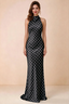 Front view of Astrid black polka dot halter maxi dress, showing the halter neckline.