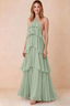 Front view of Audrey sage green chiffon maxi dress with crossed halter straps and cascading tiered ruffles