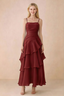 Front view of Ava burgundy chiffon maxi dress with thin straps, a fitted bodice and cascading ruffle tiers