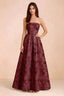 Front view of Avis burgundy floral sequin strapless maxi dress with a fitted waist and full A-line skirt