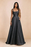 Front studio view of Becky black polka dot satin maxi dress showing the square neckline, pleated bodice and full A-line skirt