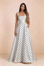 Front studio view of Becky white polka dot satin maxi dress showing the square neckline, pleated bodice and full A-line skirt