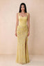 Front studio view of Betsy yellow square-neck corset maxi dress with a floral skirt and high slit