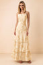 Front studio view of Bonnie yellow floral lace maxi dress with thin straps and three ruffle tiers