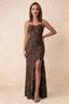 Front studio view of Brianna chocolate brown floral maxi dress with thin straps and a high ruffle-edged opening