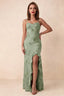 Front studio view of Brianna sage green floral maxi dress with thin straps and a high ruffle-edged opening