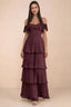 Front studio view of Seraphina wine tiered ruffle maxi dress with a long flowing skirt