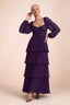 Front studio view of Sienna grape tiered pleated maxi dress with a long flowing skirt