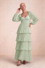 Front studio view of Sienna light green tiered pleated maxi dress with a long flowing skirt