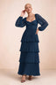 Front studio view of Sienna navy tiered pleated maxi dress with a long flowing skirt