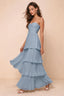 Front studio view of Sonia dusty blue tiered pleated maxi dress with a long flowing skirt