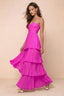 Front studio view of Sonia fuchsia tiered pleated maxi dress with a long flowing skirt