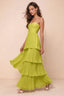 Front studio view of Sonia lemon green tiered pleated maxi dress with a long flowing skirt