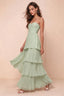 Front studio view of Sonia light green tiered pleated maxi dress with a long flowing skirt