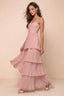 Front studio view of Sonia light pink tiered pleated maxi dress with a long flowing skirt