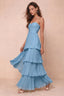 Front studio view of Sonia steel blue tiered pleated maxi dress with a long flowing skirt