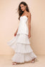Front studio view of Sonia white tiered pleated maxi dress with a long flowing skirt