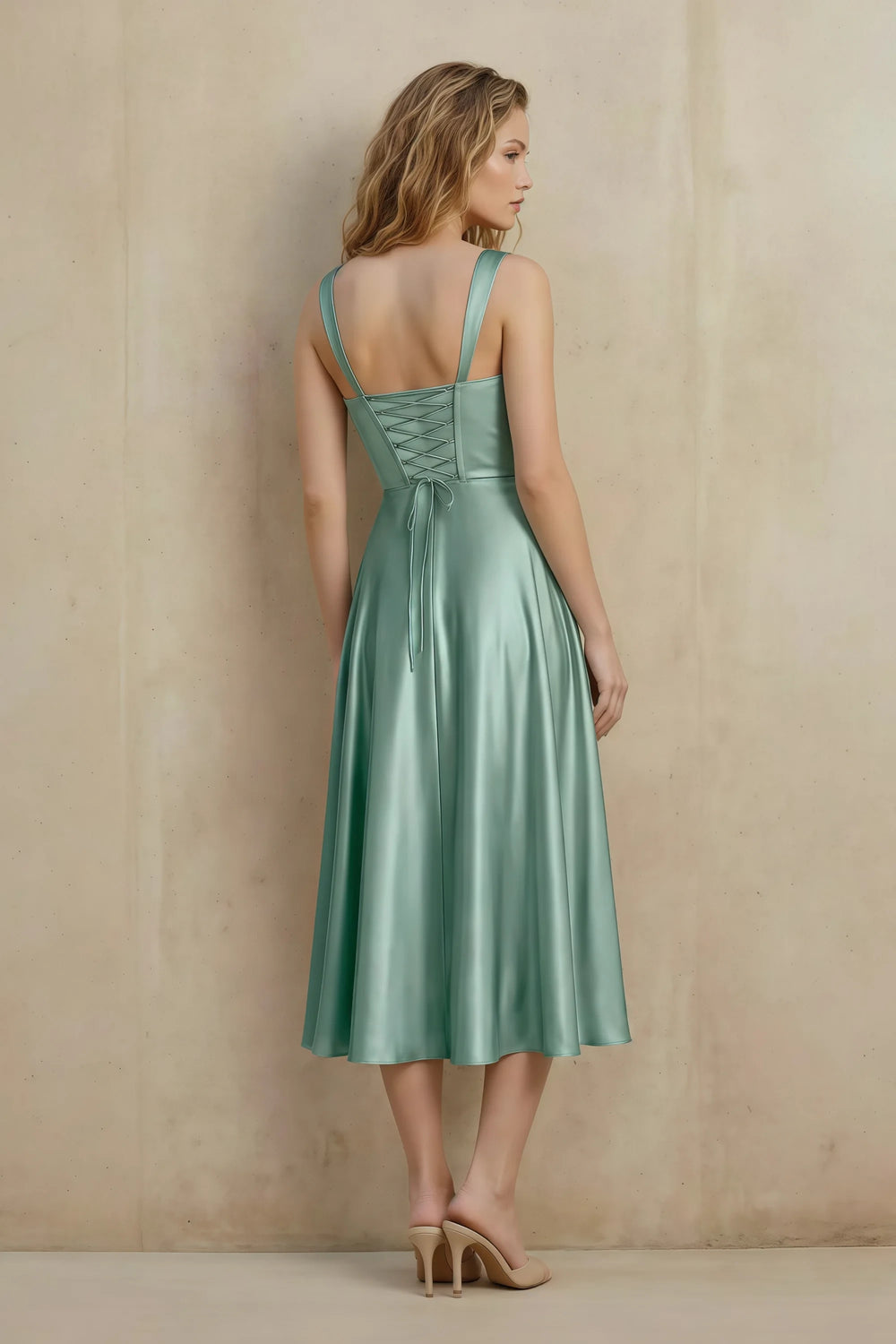 Translation missing: en.Back view of the LVLVS Abby agave midi dress, showing the lace-up bodice, shoulder straps and flowing calf-length skirt. content.product_image_secondary