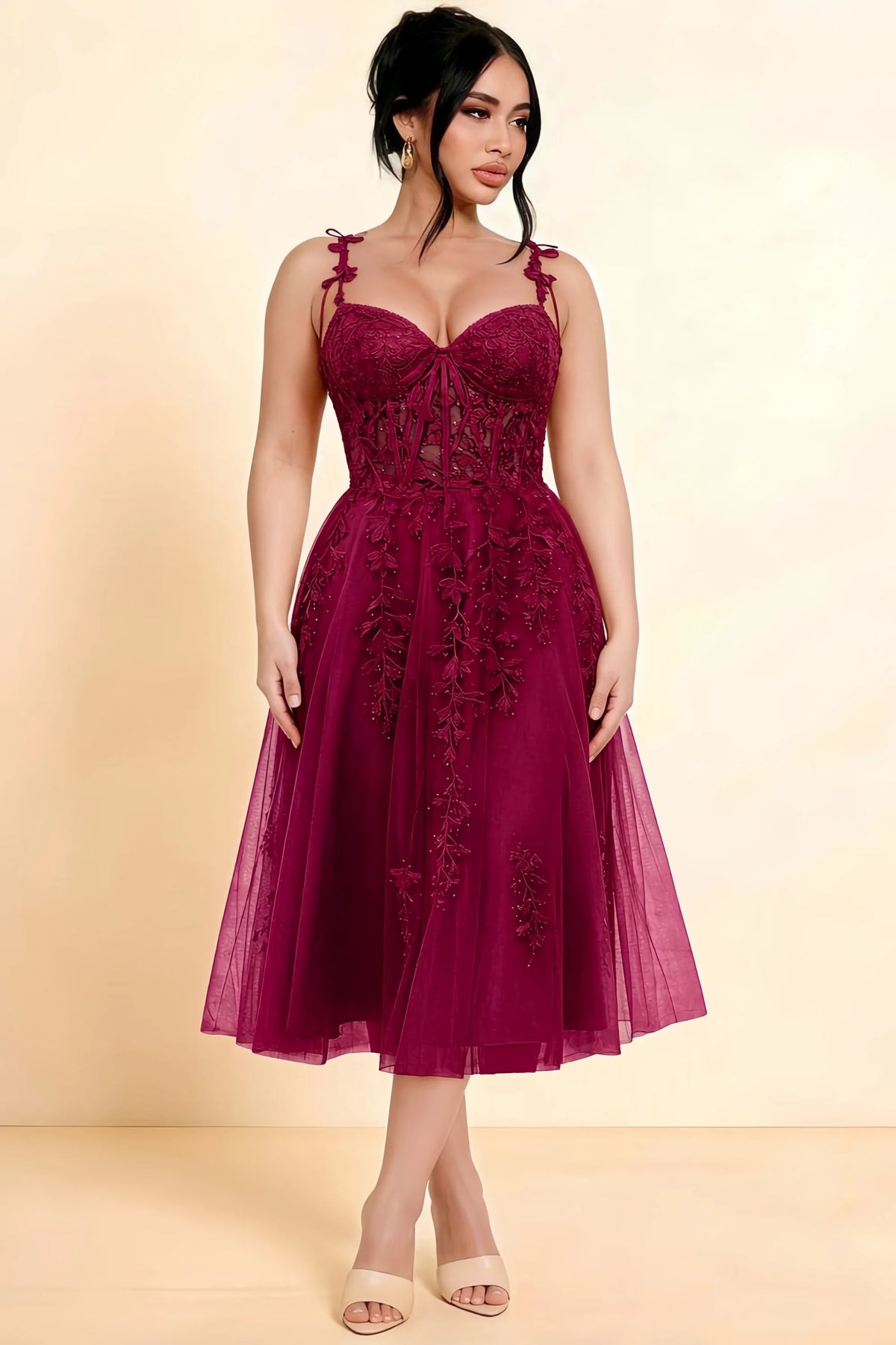 Full-length view of a model wearing the LVLVS Adeline burgundy midi dress, showing the fitted lace bodice and flared calf-length skirt.