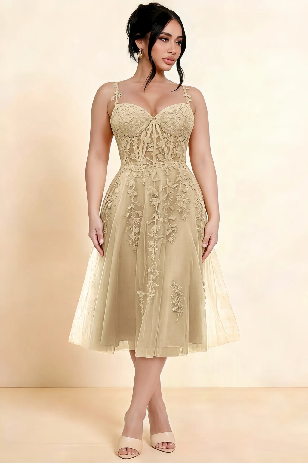 Full-length view of a model wearing the LVLVS Adeline champagne midi dress, showing the fitted lace bodice and flared calf-length skirt.