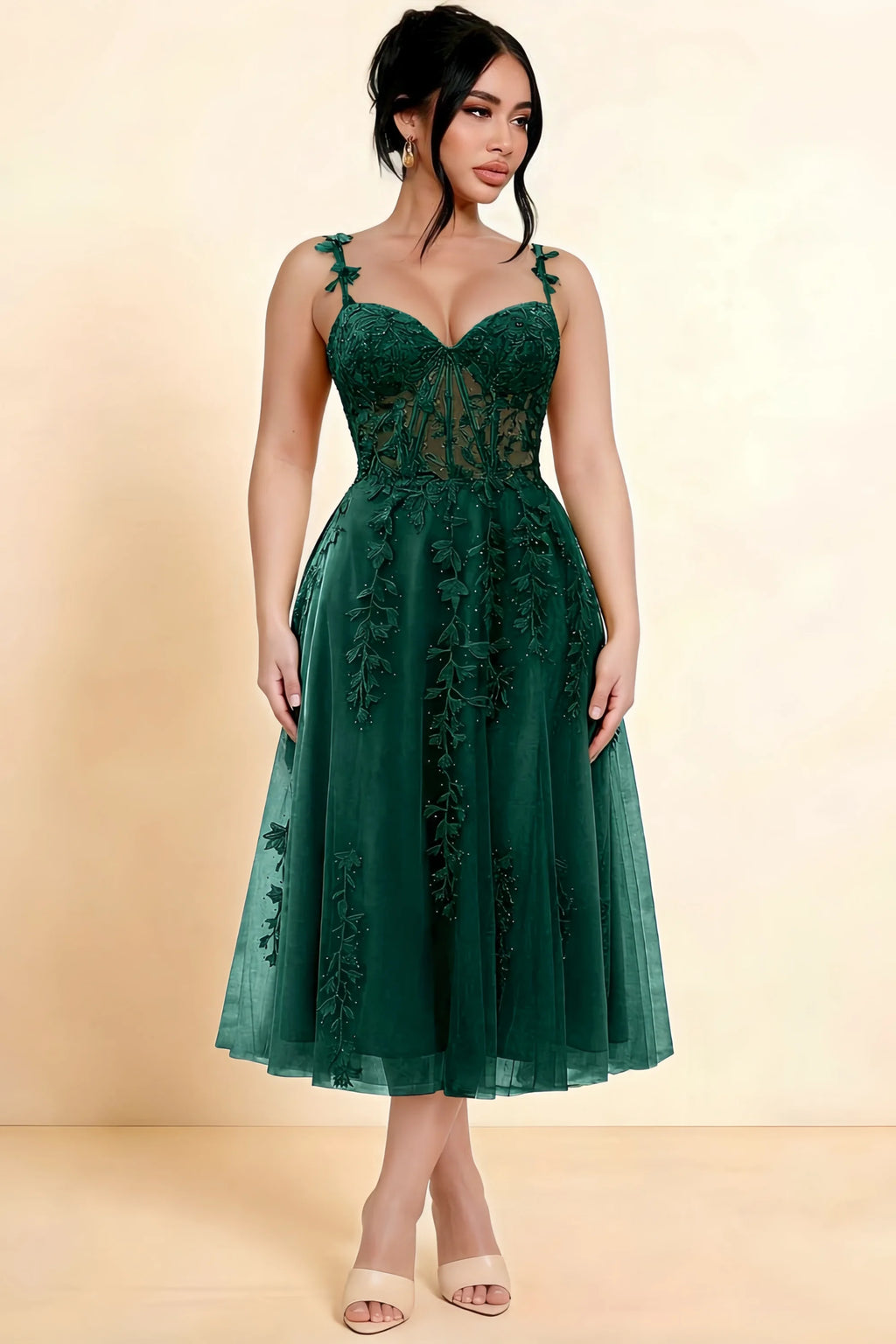 Full-length view of a model wearing the LVLVS Adeline dark green midi dress, showing the fitted lace bodice and flared calf-length skirt.