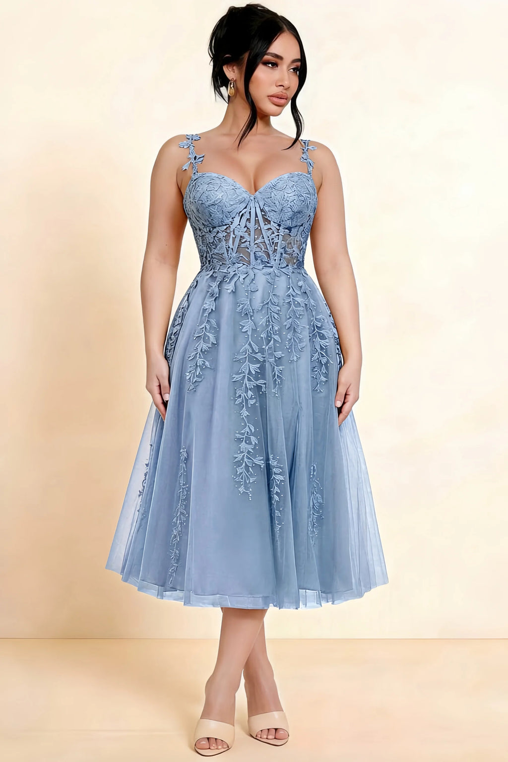 Full-length view of a model wearing the LVLVS Adeline dusty blue midi dress, showing the fitted lace bodice and flared calf-length skirt.