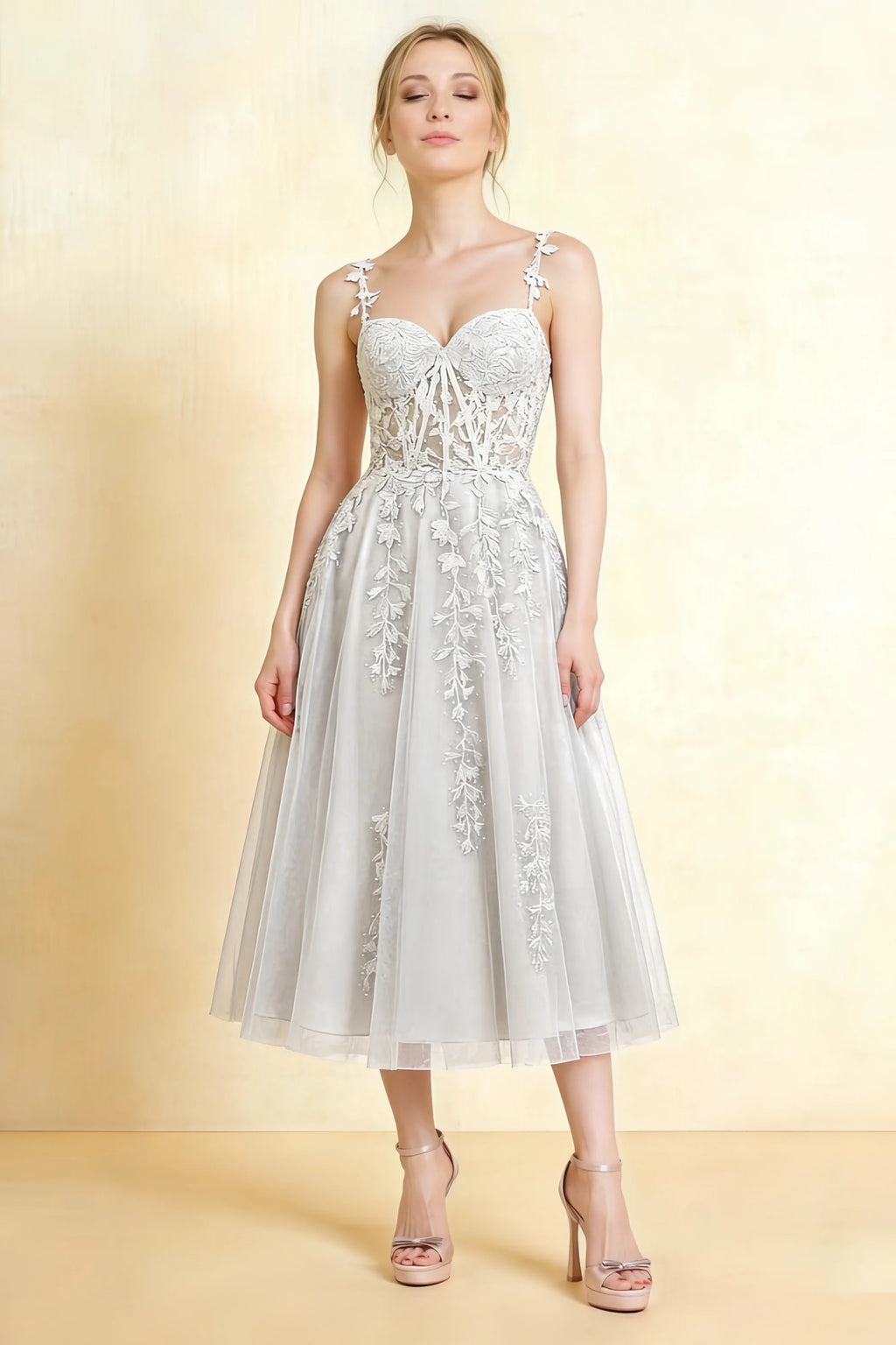 Front view of the LVLVS Adeline white midi dress, showing the sweetheart neckline, floral lace straps and flared layered skirt.