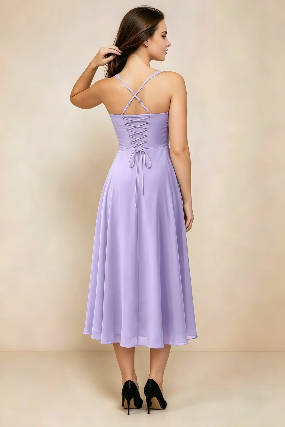 Translation missing: en.Back view of the LVLVS Alessandra lilac midi dress, showing the crossed straps, lace-up bodice and flowing midi skirt. content.product_image_secondary