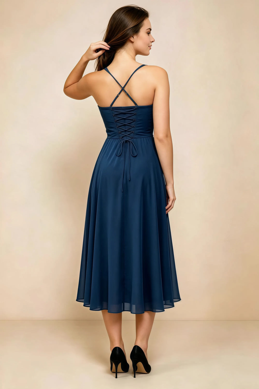Translation missing: en.Back view of the LVLVS Alessandra navy midi dress, showing the crossed straps, lace-up bodice and flowing midi skirt. content.product_image_secondary