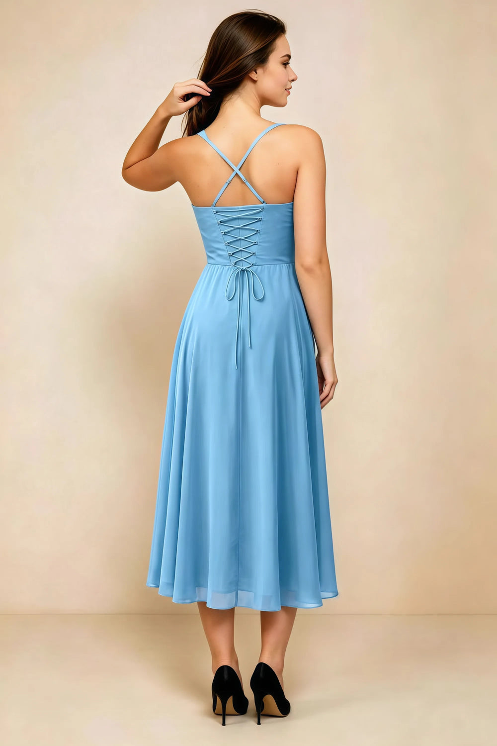 Translation missing: en.Back view of the LVLVS Alessandra steel blue midi dress, showing the crossed straps, lace-up bodice and flowing midi skirt. content.product_image_secondary