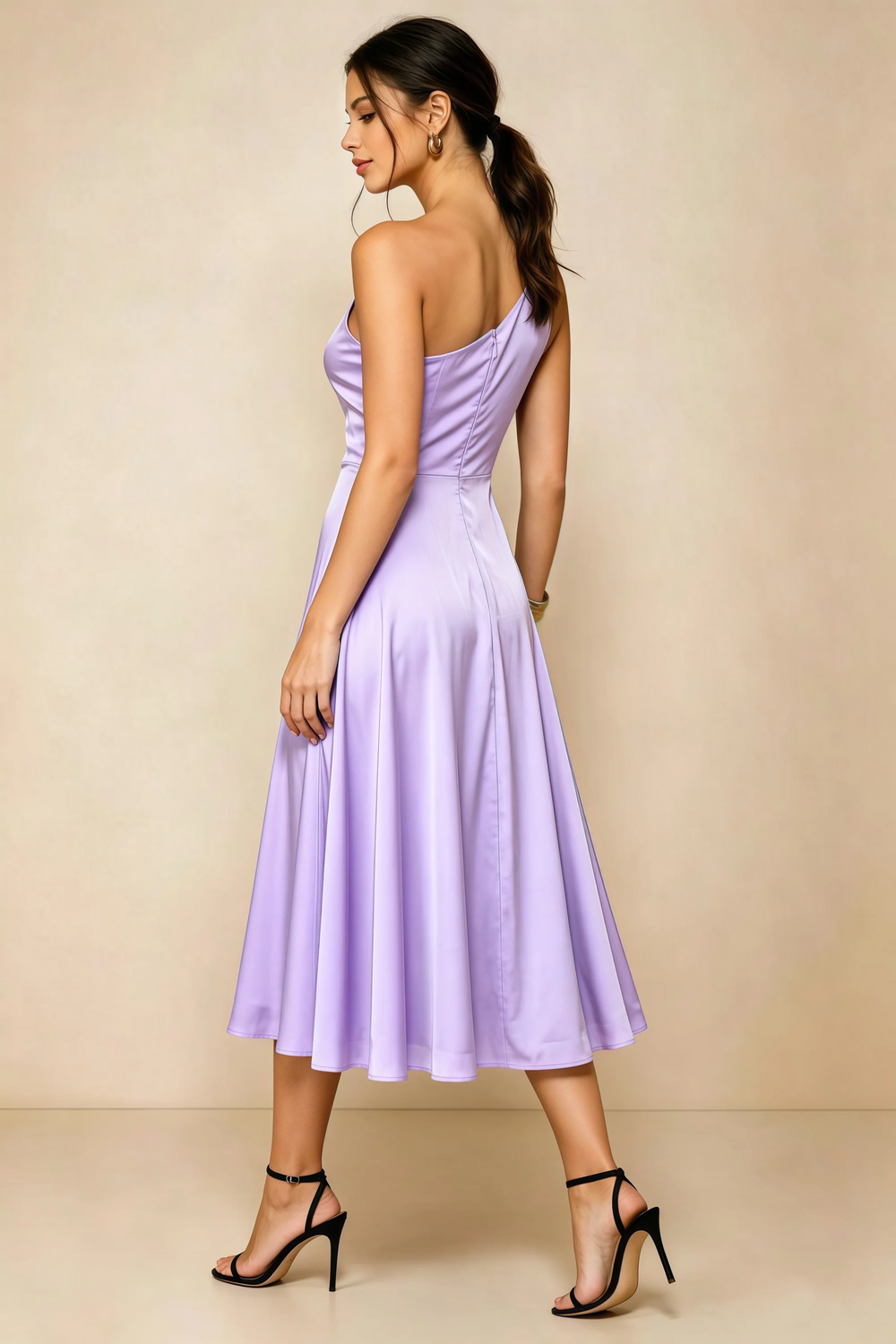Translation missing: en.Rear three-quarter view of the LVLVS Alexa lilac midi dress, showing the asymmetric back neckline, fitted waist and flared midi skirt. content.product_image_secondary