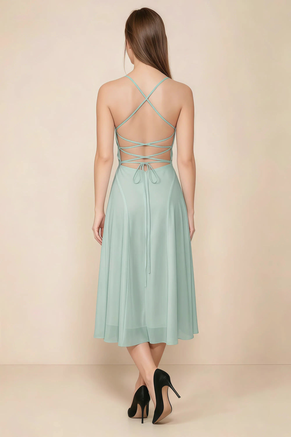 Translation missing: en.Back view of the LVLVS Alina agave midi dress, showing the open back, crisscross straps and lace-up waist ties. content.product_image_secondary
