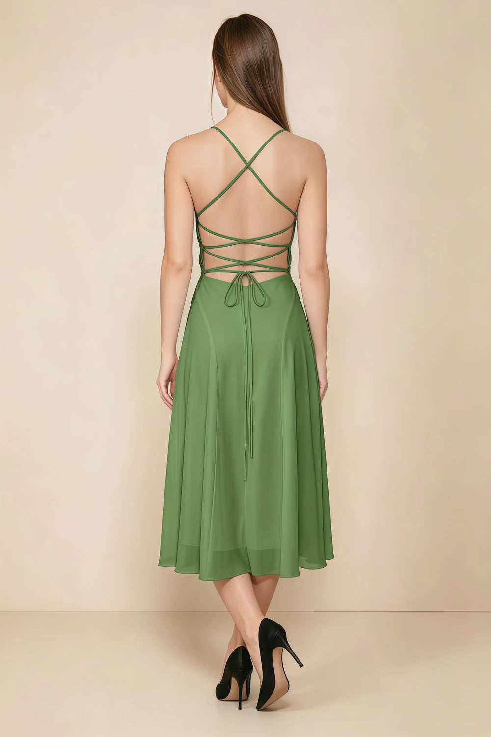 Translation missing: en.Back view of the LVLVS Alina basil midi dress, showing the open back, crisscross straps and lace-up waist ties. content.product_image_secondary