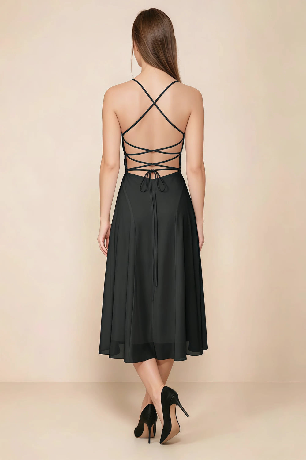 Translation missing: en.Back view of the LVLVS Alina black midi dress, showing the open back, crisscross straps and lace-up waist ties. content.product_image_secondary