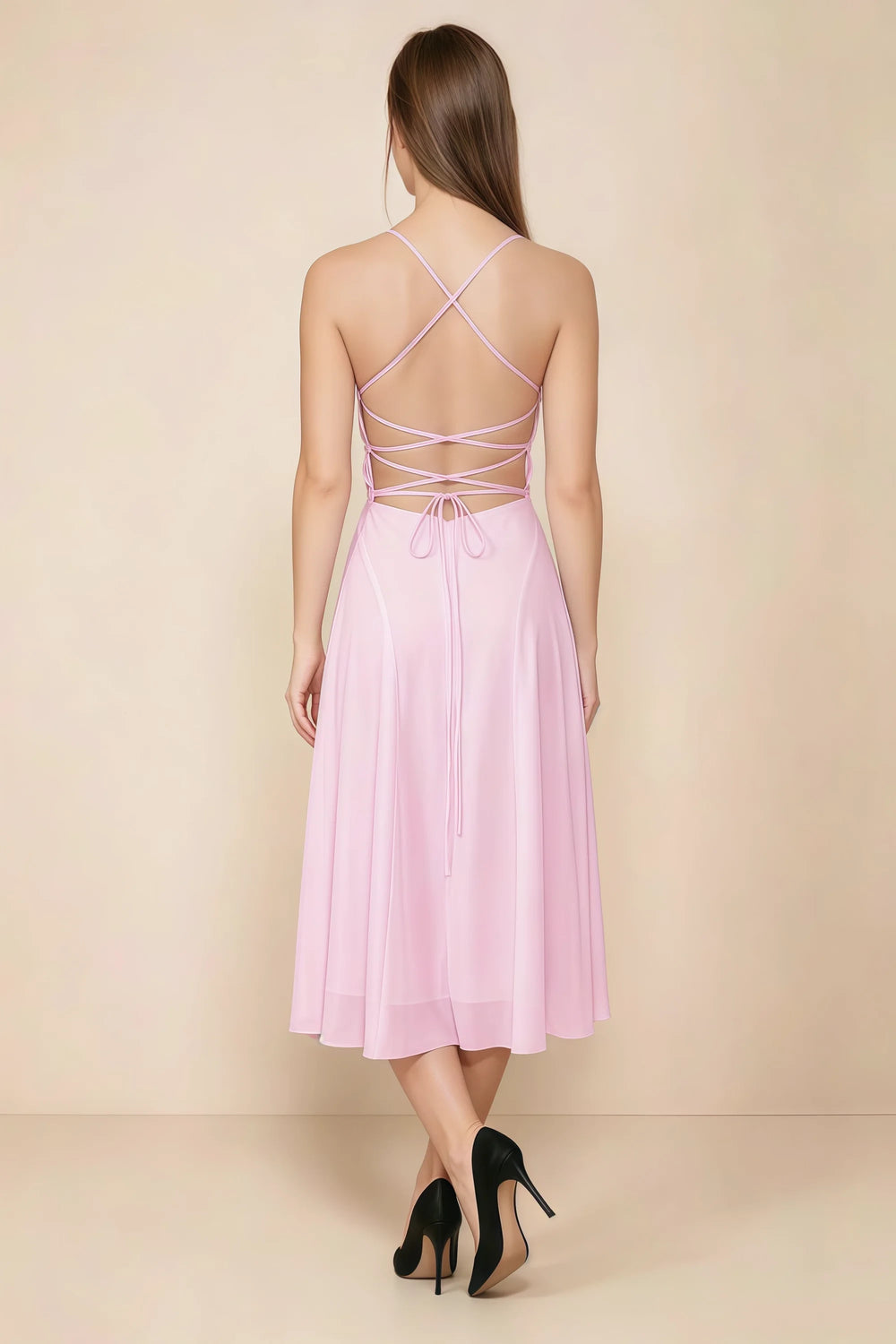 Translation missing: en.Back view of the LVLVS Alina candy pink midi dress, showing the open back, crisscross straps and lace-up waist ties. content.product_image_secondary