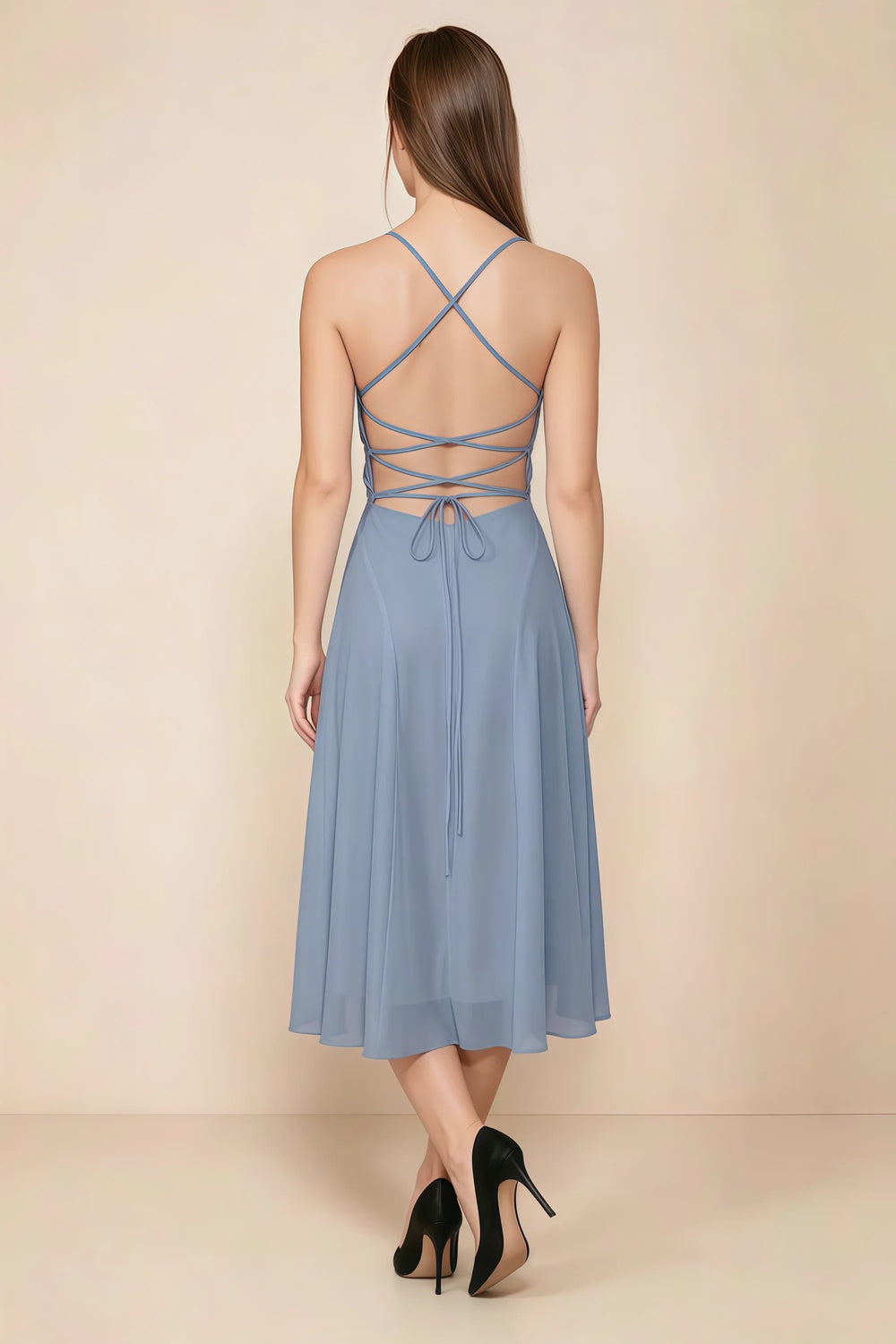 Translation missing: en.Back view of the LVLVS Alina dusty blue midi dress, showing the open back, crisscross straps and lace-up waist ties. content.product_image_secondary