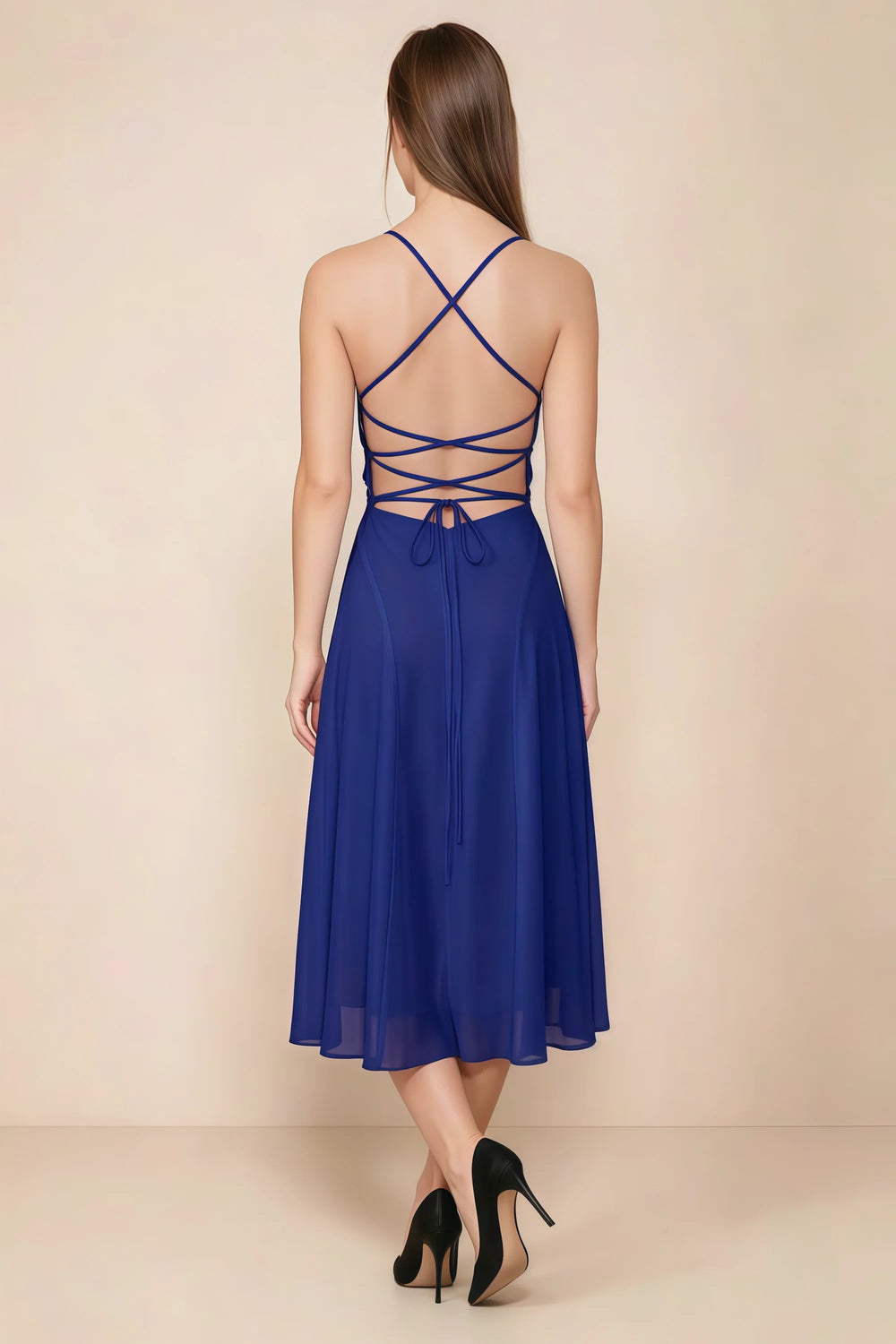 Translation missing: en.Back view of the LVLVS Alina royal blue midi dress, showing the open back, crisscross straps and lace-up waist ties. content.product_image_secondary