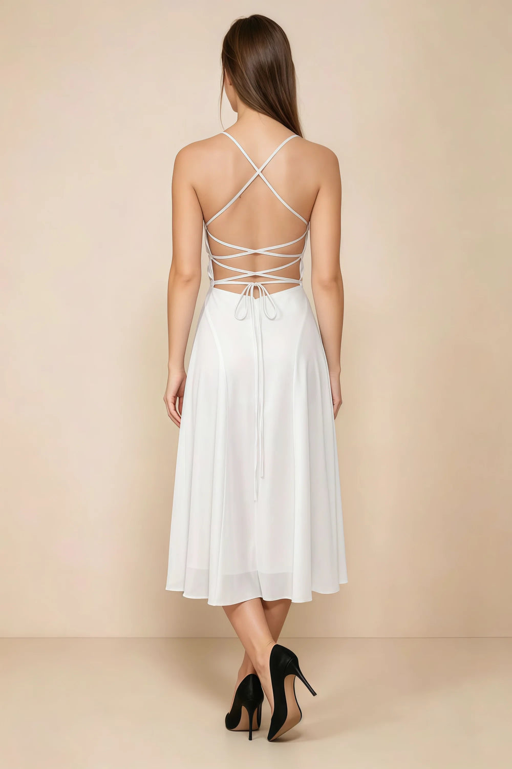 Translation missing: en.Back view of the LVLVS Alina white midi dress, showing the open back, crisscross straps and lace-up waist ties. content.product_image_secondary