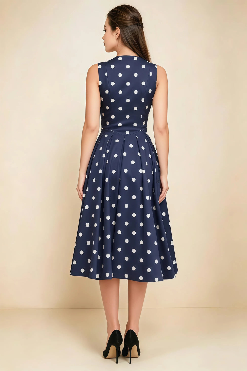 Translation missing: en.Rear view of the LVLVS Alison navy polka dot midi dress, showing the covered back, shaped waist and full midi skirt. content.product_image_secondary