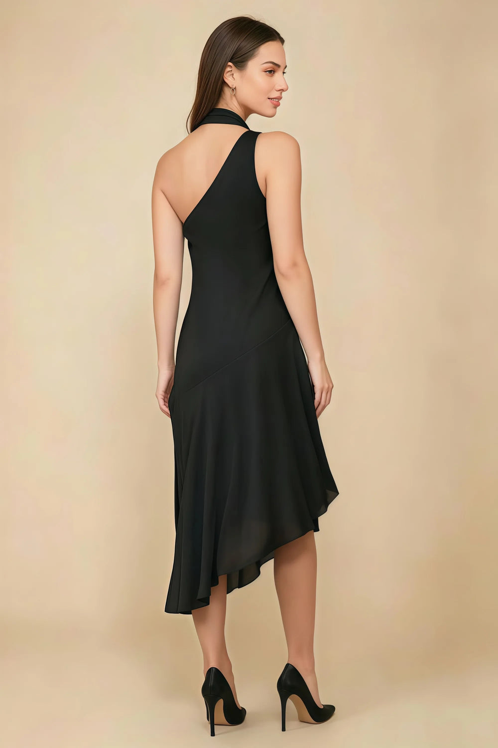 Translation missing: en.Rear three-quarter view of the LVLVS Alma black midi dress, showing the diagonal back neckline and asymmetric midi skirt. content.product_image_secondary