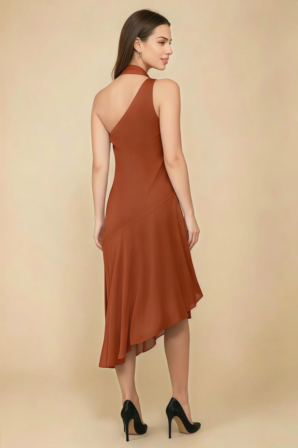 Translation missing: en.Rear three-quarter view of the LVLVS Alma burnt orange midi dress, showing the diagonal back neckline and asymmetric midi skirt. content.product_image_secondary